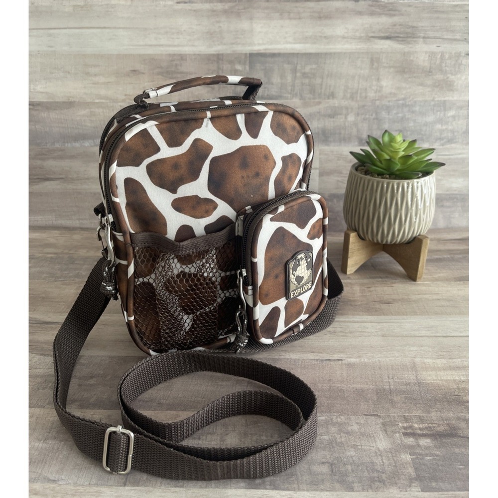 Woman's crossbody bag animal print pockets zippers strap phone holder explore